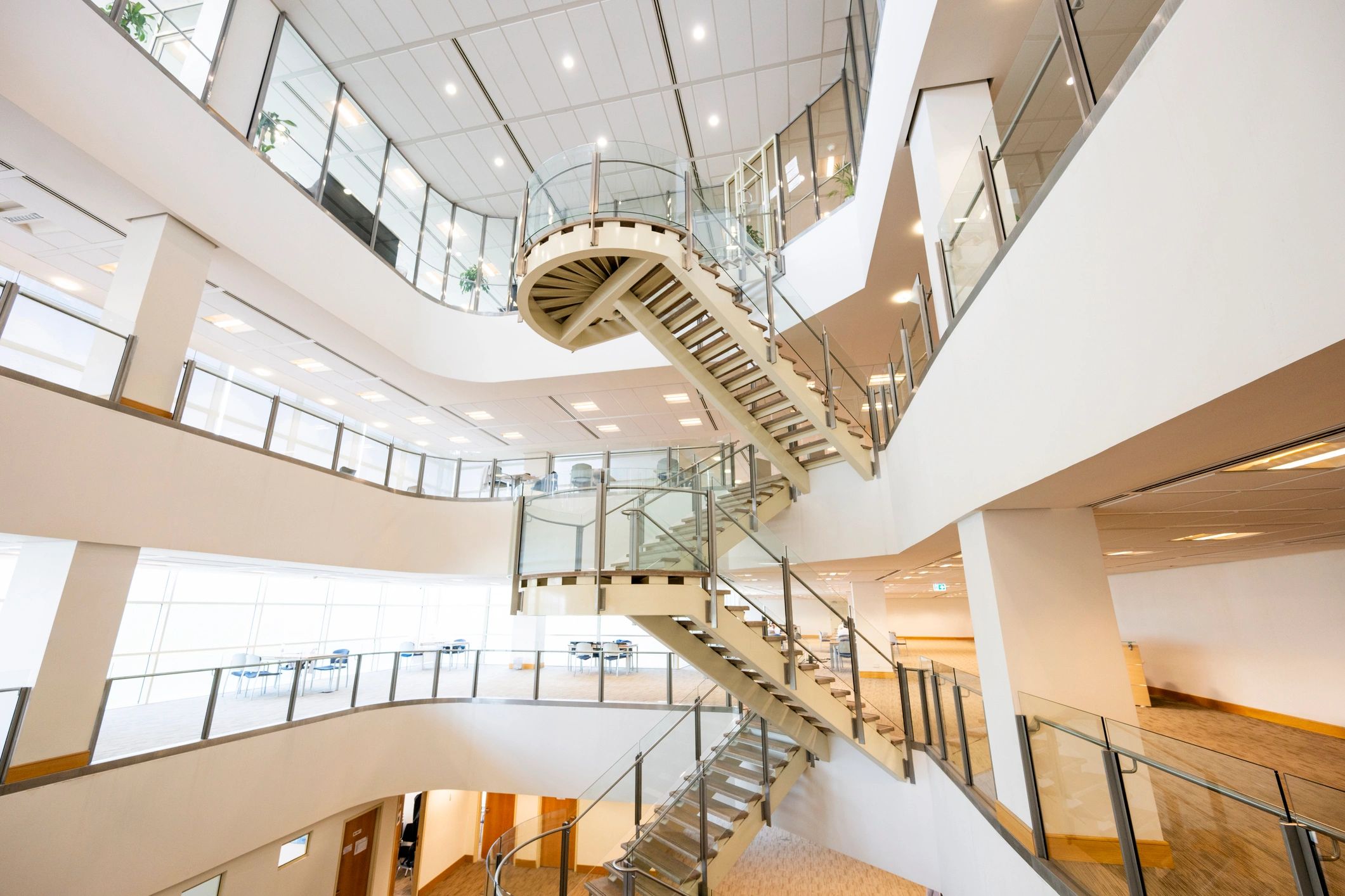 Modern commercial interior with staircase and natural light